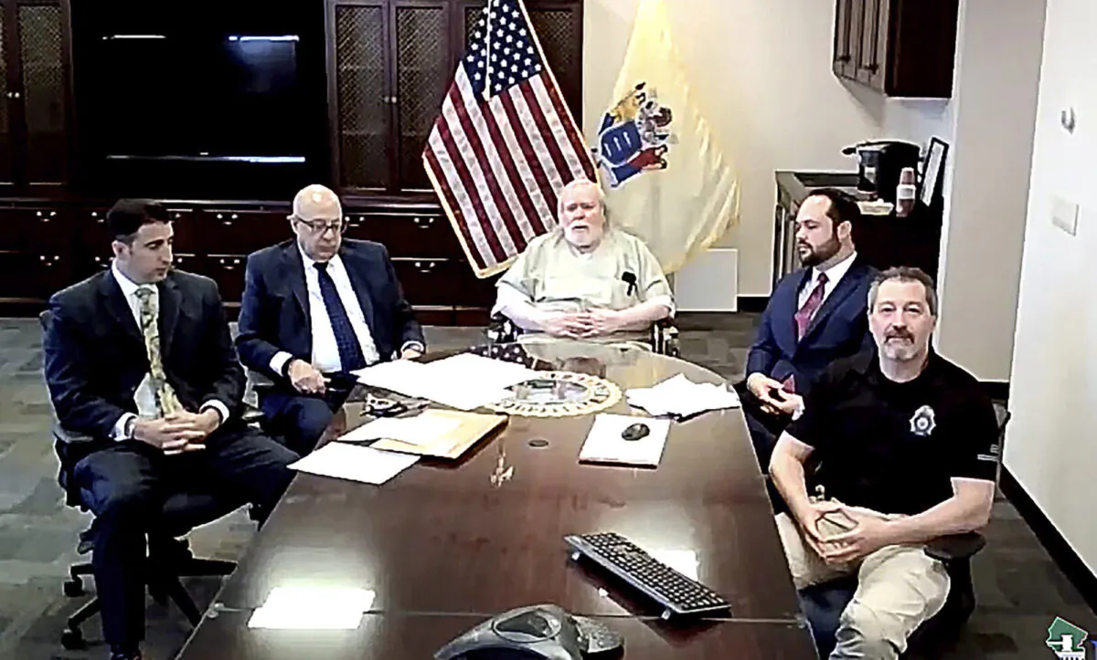 Richard Cottingham (C) known as the "Torso Killer," pleads guilty to two 1974 murders, at a New Jersey Courts virtual hearing, on April 27, 2021. (New Jersey Courts via AP)