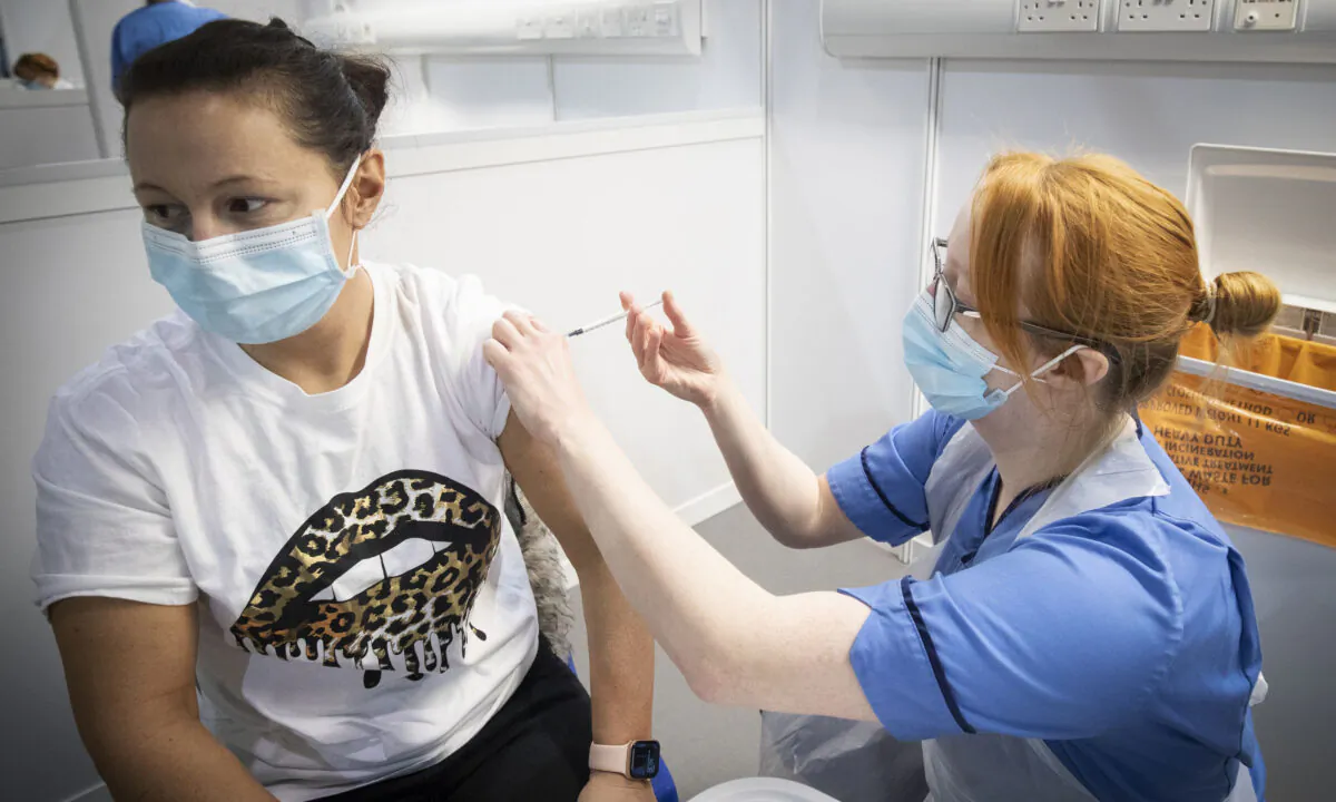 A woman receiving CCP virus vaccination on Jan. 23, 2021. (PA)