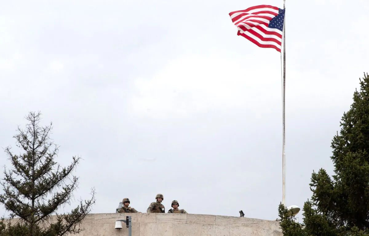U.S. soldiers stand guard on the roof of the U.S. Embassy in Ankara on April 26, 2021, after the the United States closed its Ankara embassy and the consulate in Istanbul and two other cities for citizen and visa services as a precaution for April 26 and April 27. The closure came after Turkey's Recep Tayyip Erdogan on April 26, 2021, denounced U.S. President Joe Biden's recognition of the Armenian genocide as "groundless" and harmful to bilateral ties. (Adem Altan/AFP via Getty Images)