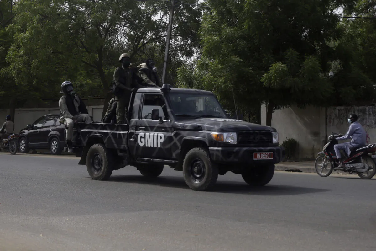 Police officers patrol the street following a protest in N'Djamena, Chad, on April 27, 2021. (Sunday Alamba/ AP Photo)