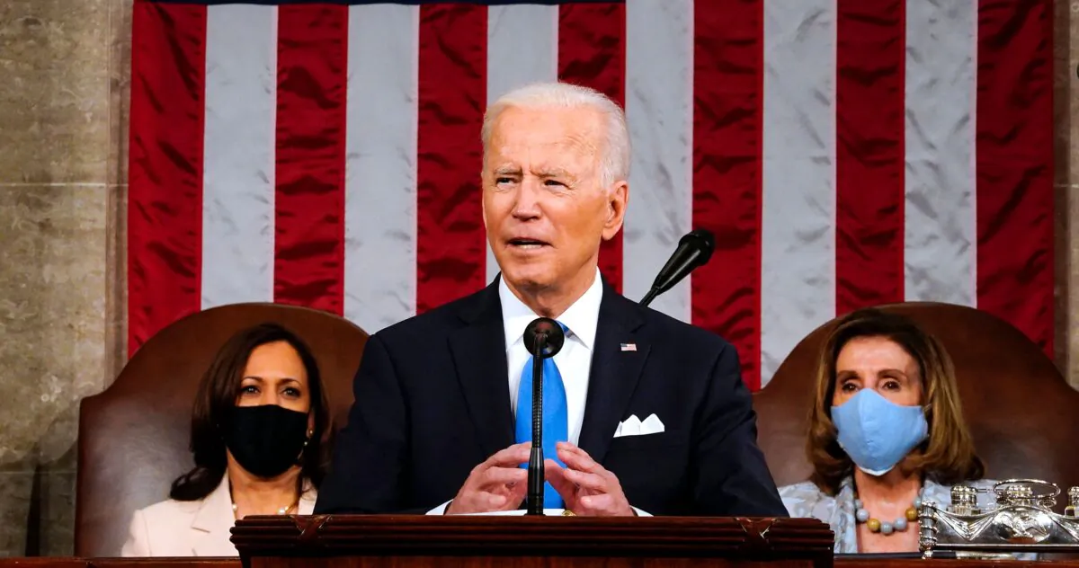 President Joe Biden, flanked by Vice President Kamala Harris (L) and Speaker of the House of Representatives Nancy Pelosi (R), addresses a joint session of Congress at the U.S. Capitol in Washington, on April 28, 2021. (Melina Mara/Pool/AFP via Getty Images)