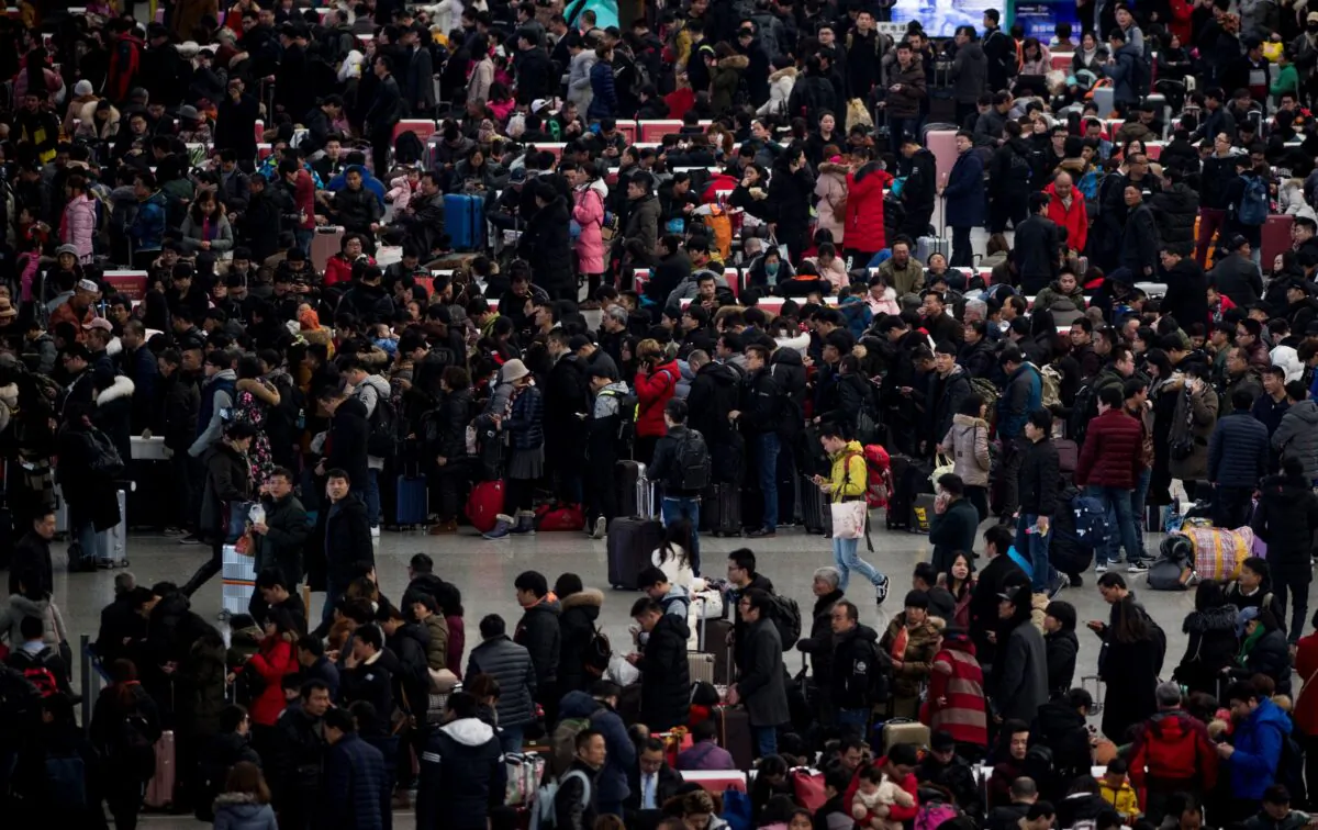 Passengers gather in the waiting hall at Hongqiao Railway Station ahead of the Lunar New Year holidays in Shanghai, China, on Feb. 6, 2018.
(Johannes Eisele/AFP via Getty Images)