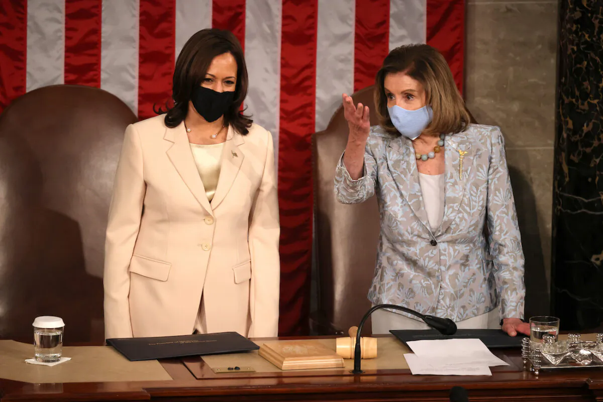 Vice President Kamala Harris and Speaker of the House Nancy Pelosi (D-Calif.) speak after President Joe Biden addressed a joint session of congress in the House chamber of the U.S. Capitol, in Washington, on April 28, 2021. (Chip Somodevilla/Getty Images)