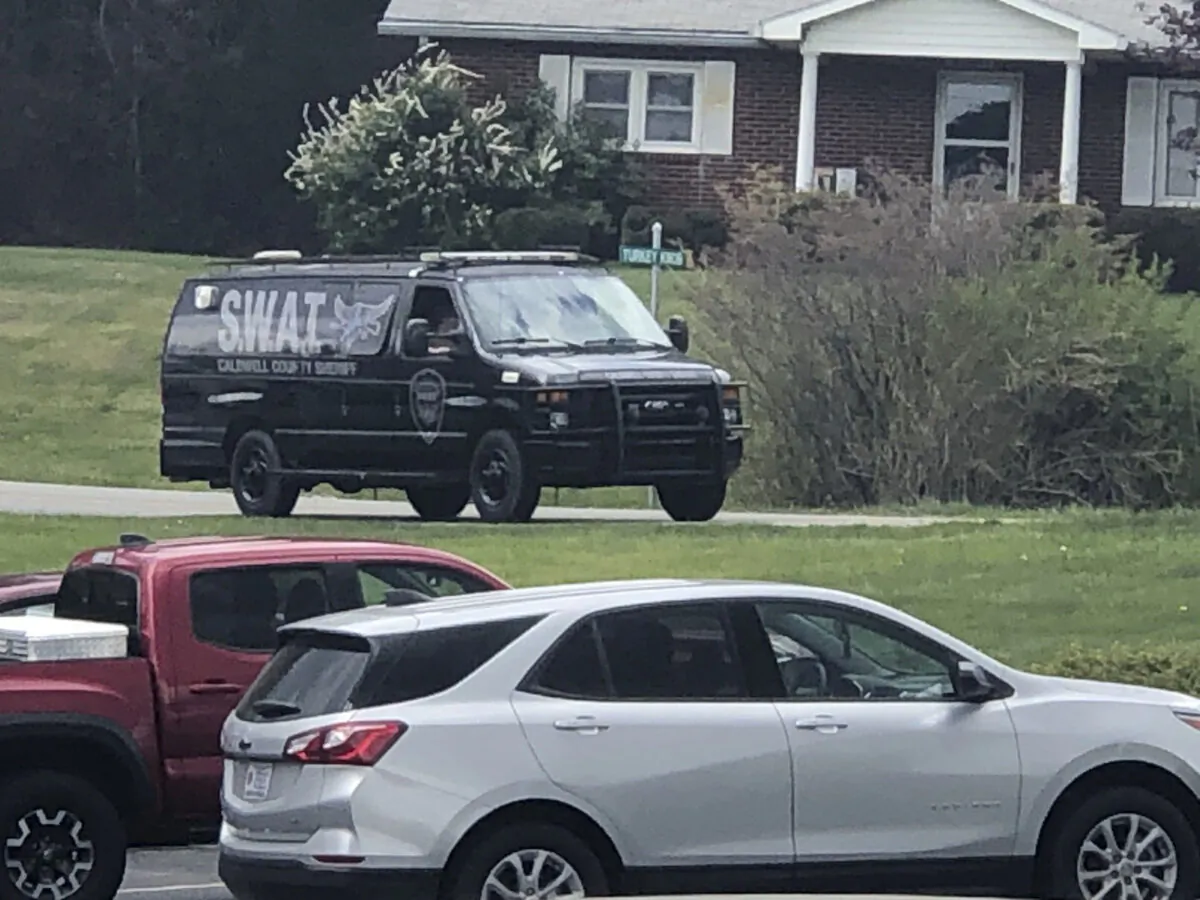 A tactical van from Caldwell County, North Carolina, sits on stand-by at a staging area in Boone, N.C., on April 28, 2021. (Morgan Frances/WJZY via AP)