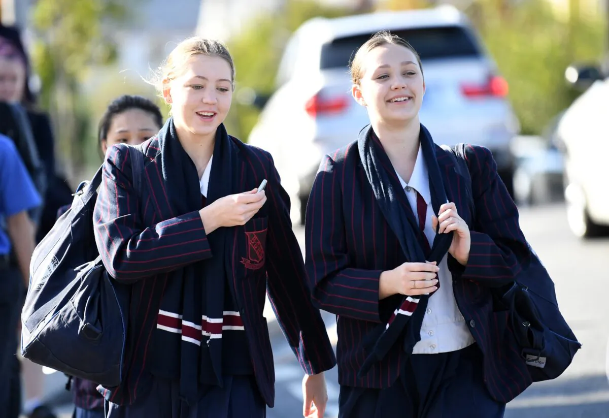 School students arrive for the first day school in Brisbane, Australia, May 11, 2020. (Dan Peled/AAP)