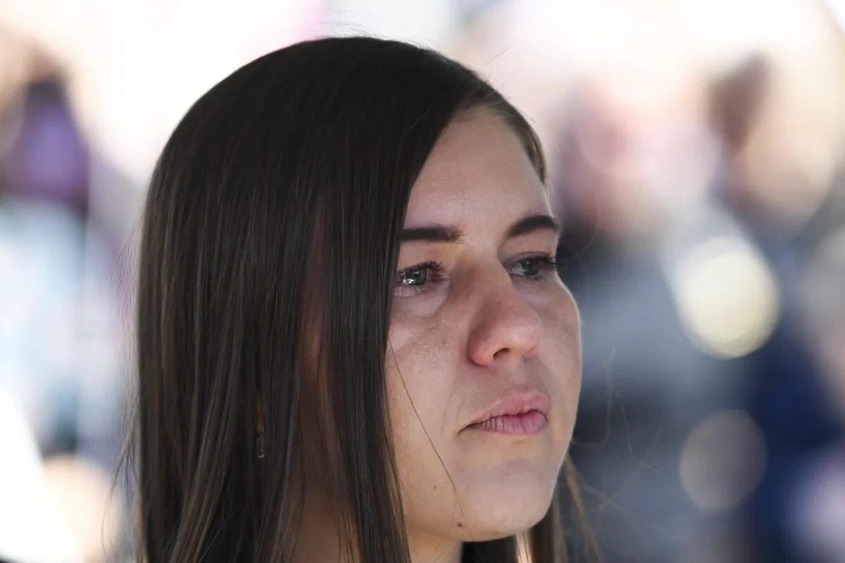 Former Liberal staffer Brittany Higgins reacts as she attends the Women's March 4 Justice in Canberra, Australia, on March 15, 2021. (Lukas Coch/AAP Image)