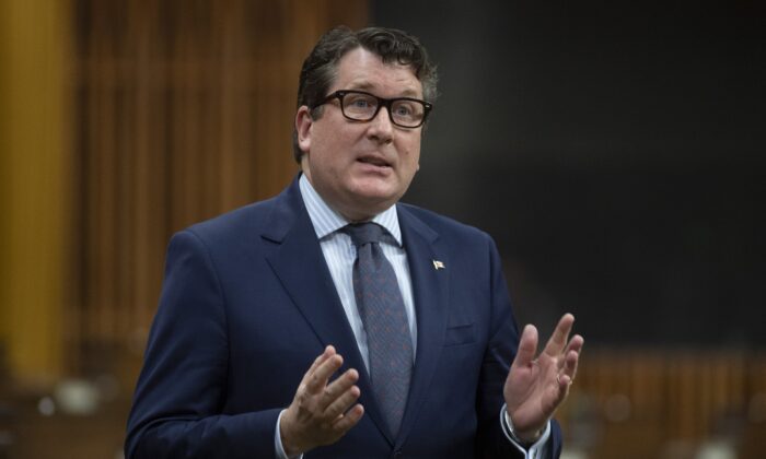 Conservative MP John Williamson rises uring Question Period in the House of Commons in Ottawa, Canada, on April 13, 2021. (Adrian Wyld/The Canadian Press)