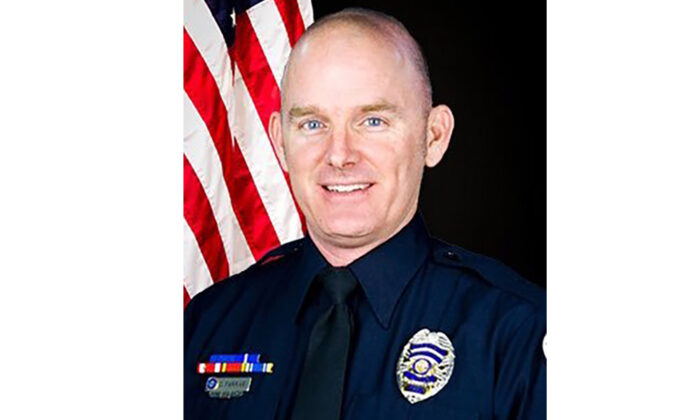 This photo provided by Chandler Police Department shows Officer Christopher Farrar.   A suspect in a stolen car hit two officers, killing Farrar and critically injuring the other, during a wild chase in Arizona, involving gunfire and multiple law enforcement agencies, authorities said Thursday, April 30, 2021. (Chandler Police Department via AP)