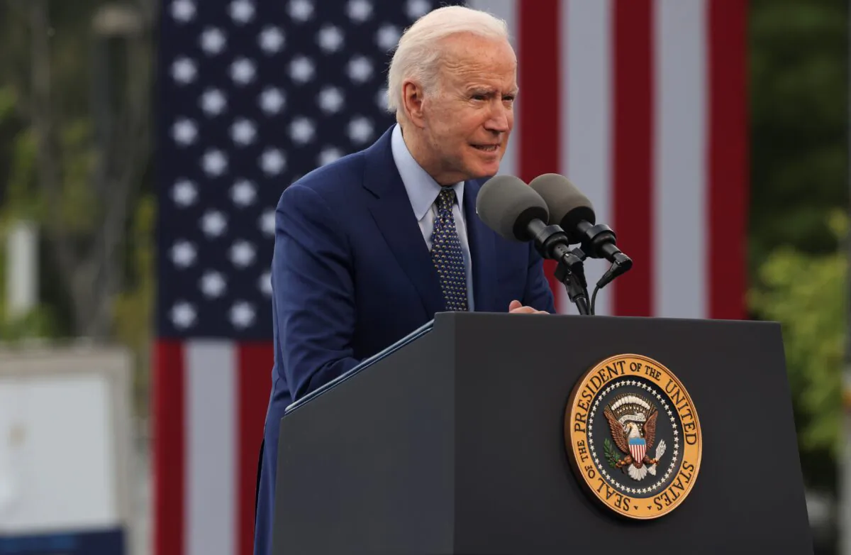 President Joe Biden speaks during the Democratic National Committee's "Back on Track" drive-in car rally to celebrate the president's 100th day in office at the Infinite Energy Center in Duluth, Ga., on April 29, 2021. (Evelyn Hockstein/Reuters)