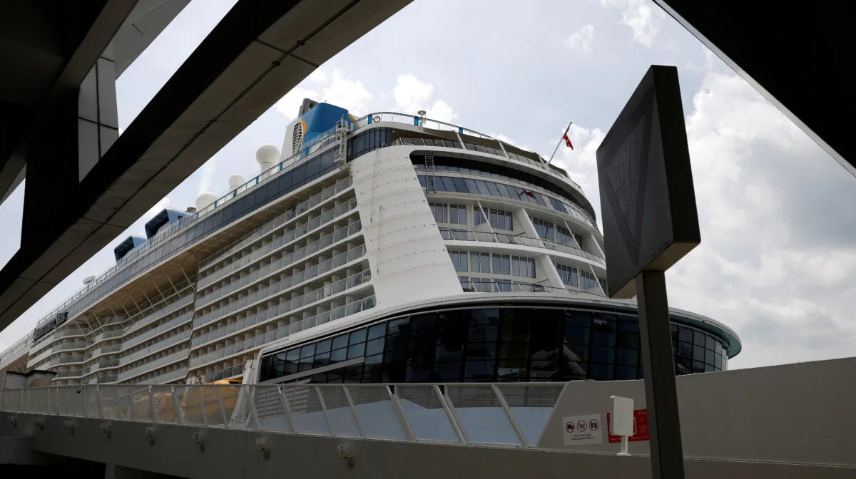 Royal Caribbean's Quantum of the Seas cruise ship docks at Marina Bay Cruise Center after a passenger tested positive for coronavirus disease (COVID-19) during a cruise to nowhere, in Singapore, on Dec. 9, 2020. (Edgar Su/Reuters)
