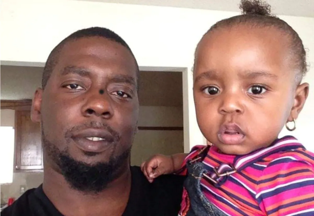 Andrew Brown Jr., who was killed by law enforcement last week, poses with his daughter in an undated family photograph. (Ben Crump Law/Handout via Reuters)