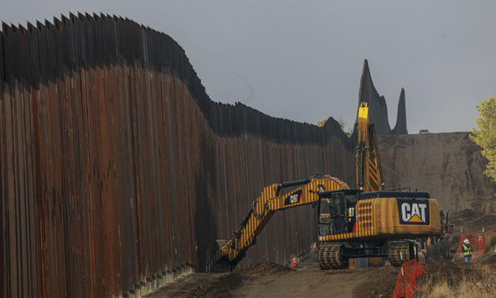 Work is done on a new border wall being constructed in Jacumba, Calif., on Jan. 22, 2021. (Sandy Huffaker/Getty Images)