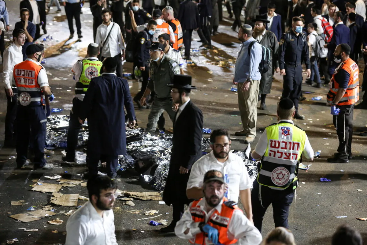 Medics and rescue workers attend to the Lag B'Omer event in Mount Meron, northern Israel, where fatalities were reported among the thousands of ultra-Orthodox Jews gathered at the tomb of a 2nd-century sage for annual commemorations that include all-night prayer and dance, at Mount Meron, Israel, on April 30, 2021. (Reuters)