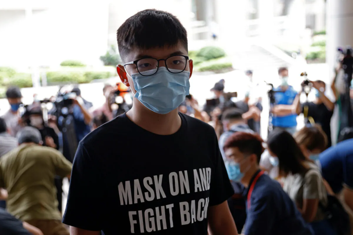 Pro-democracy activist Joshua Wong arrives at the Eastern Magistrates' Courts over illegal assembly and violation of an emergency law banning face coverings last year, in Hong Kong, China on Sept. 30, 2020. (Tyrone Siu/REUTERS)