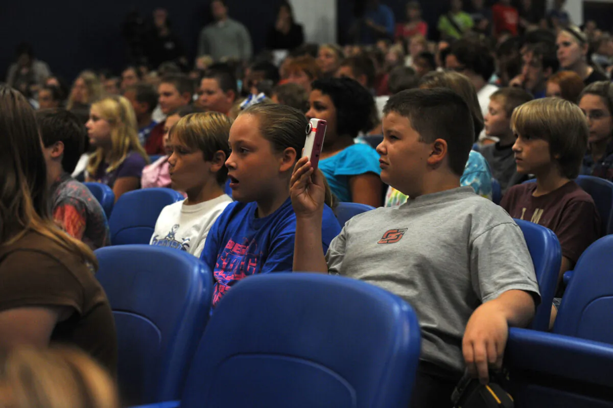 Students look on during an assembly at Checotah High School to surprise students with more than $117,000 in new music instruments, a joint gift from Underwood?s C.A.T.S. Foundation and ACM Lifting Lives in Checotah, Okla. on Aug. 28, 2009. (Rick Diamond/Getty Images for ACM)