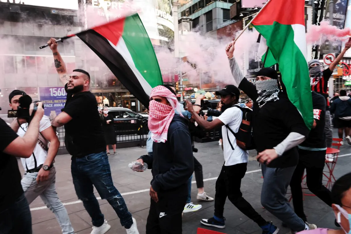 Pro-Palestinian protesters march in the streets during a violent clash with Israel supporters and police in Times Square in New York City on May 20, 2021. (Spencer Platt/Getty Images)