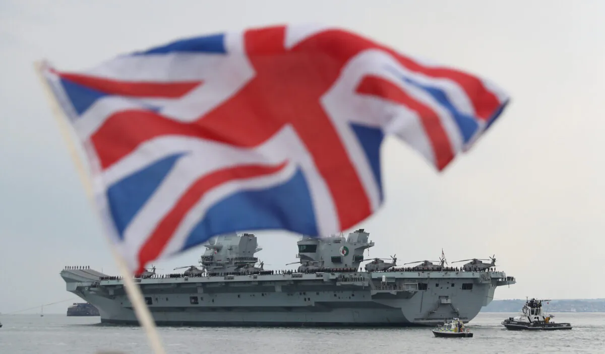 The Royal Navy aircraft carrier HMS Queen Elizabeth leaves Portsmouth Naval Base in Hampshire for exercises off Scotland before heading to the Indo–Pacific region on May 1, 2021. (PA)