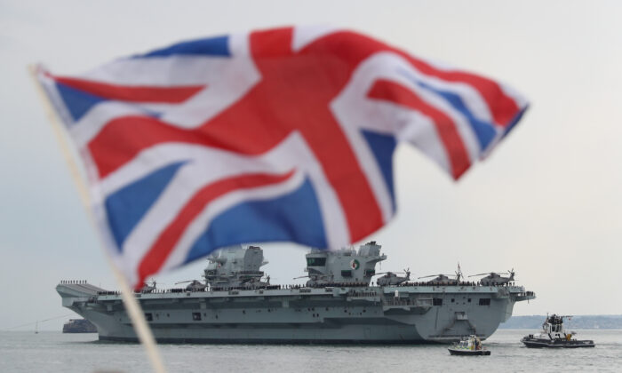 The Royal Navy aircraft carrier HMS Queen Elizabeth leaves Portsmouth Naval Base in Hampshire for exercises off Scotland before heading to the Indo–Pacific region on May 1, 2021. (PA)