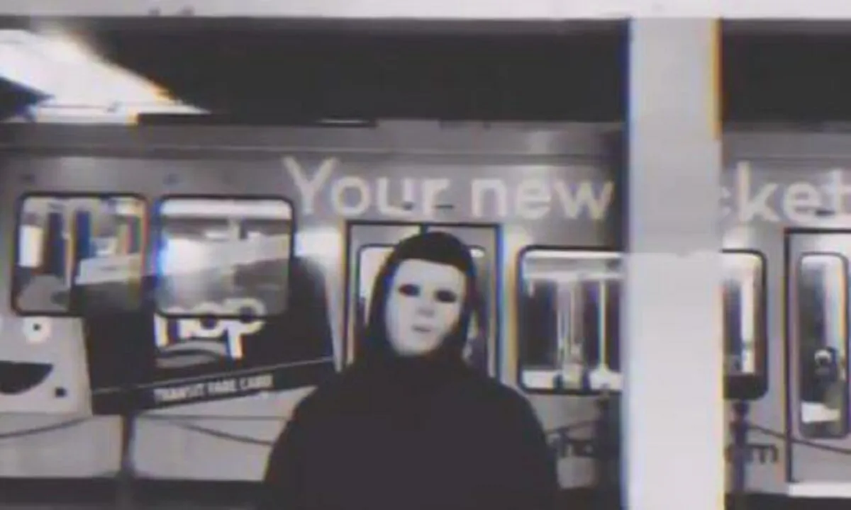 A masked person is seen during a video that contained a threat to Portland Mayor and Police Commissioner Ted Wheeler. (Screenshot via The Epoch Times)