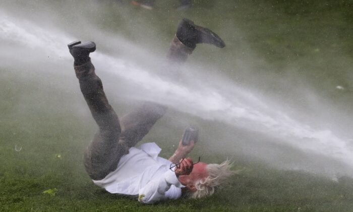 Belgium anti-lockdown protest water cannon