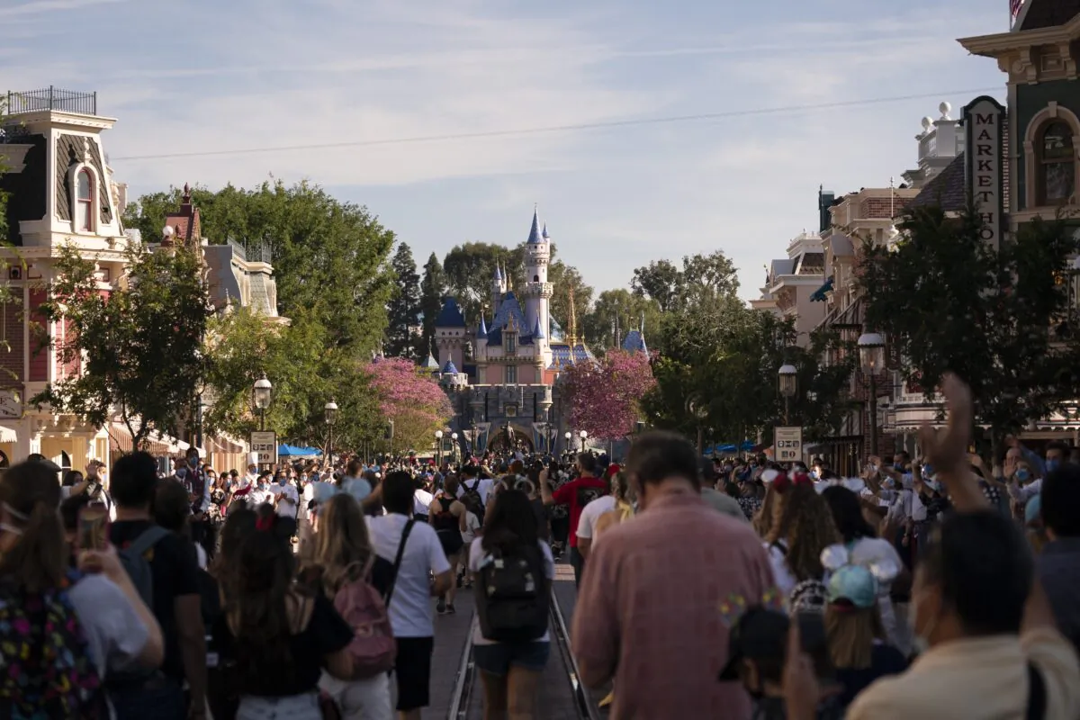 Guests walk along the Main Street USA at Disneyland in Anaheim, Calif., on April 30, 2021. (Jae C. Hong/AP Photo)