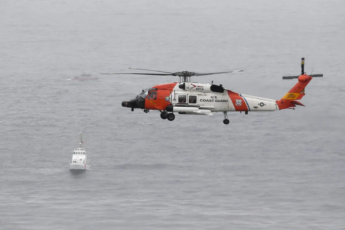 In a file photo, a U.S. Coast Guard helicopter off the San Diego coast, in San Diego, on May 2, 2021. (Denis Poroy/AP Photo)