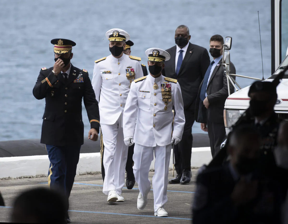 Adm. John C. Aquilino and Adm. Philip S. Davidson with Secretary of Defense Lloyd J. Austin arrive at at a Change of Command ceremony for the U.S Indo-Pacific Command, at  Joint Base Pearl Harbor-Hickam west of Honolulu, Hawaii, on April 30, 2021. (Cindy Ellen Russell/Honolulu Star-Advertiser via AP)