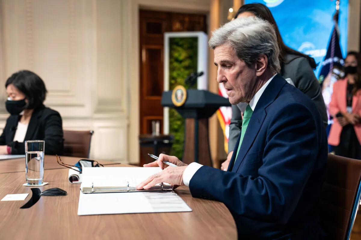 John Kerry, the special presidential envoy for climate, looks at his notes before the start of the virtual Leaders Summit on Climate in the East Room of the White House in Washington on April 23, 2021. (Anna Moneymaker-Pool/Getty Images)