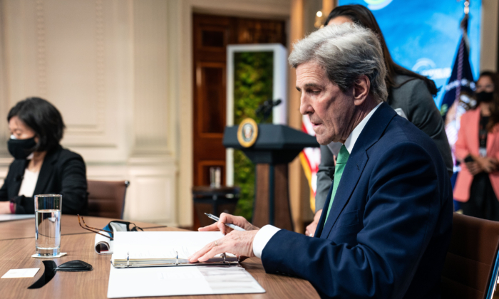 John Kerry, the Special Presidential Envoy for Climate, looks at his notes before the start of the virtual Leaders Summit on Climate in the East Room of the White House on April 23, 2021. (Anna Moneymaker-Pool/Getty Images)