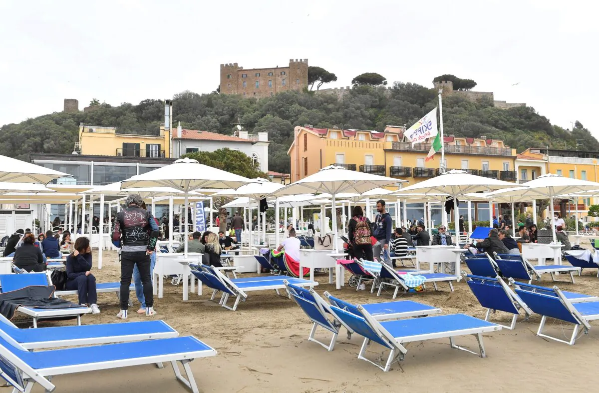 People enjoy a Sunday at the beach as COVID-19 restrictions ease around the country, in Castiglione della Pescaia, Italy, on May 2, 2021. (Jennifer Lorenzini/Reuters)