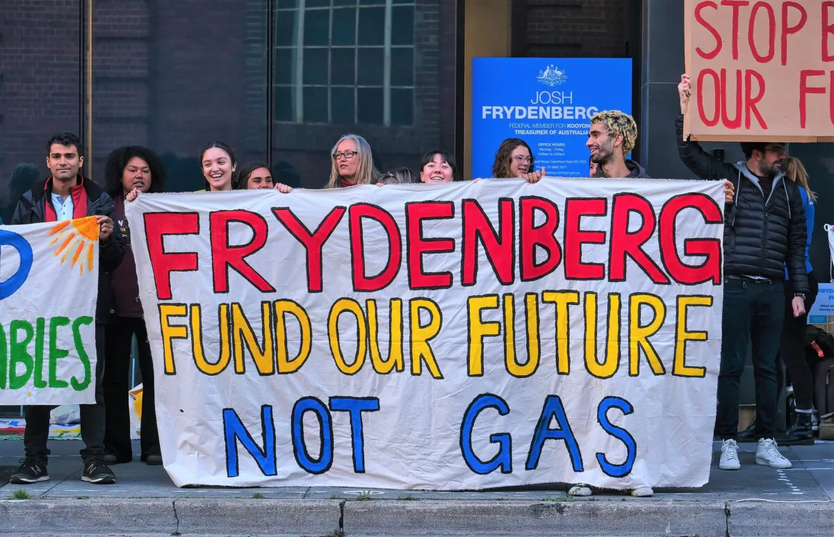 Anti-gas protesters rally outside Treasurer Josh Frydenberg’s electorate office in Melbourne, Australia on, April 29, 2021. (AAP Image/Luis Ascui) 