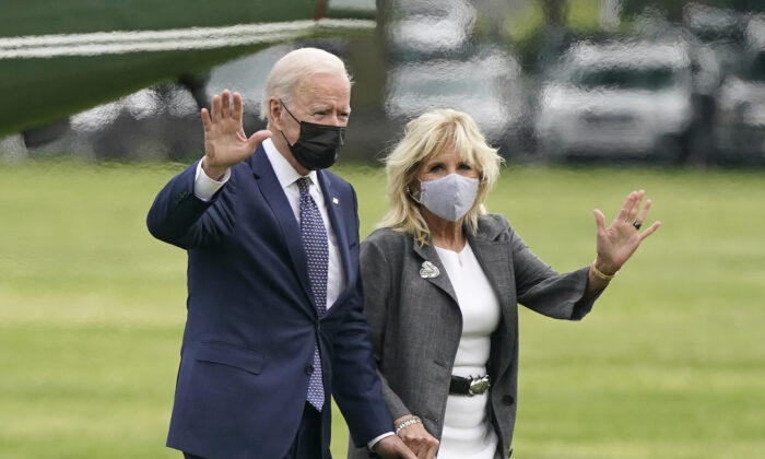 President Joe Biden and First Lady Jill Biden wave after stepping off Marine One on the Ellipse near the White House in Washington on May 3, 2021.  (Patrick Semansky/AP Photo)