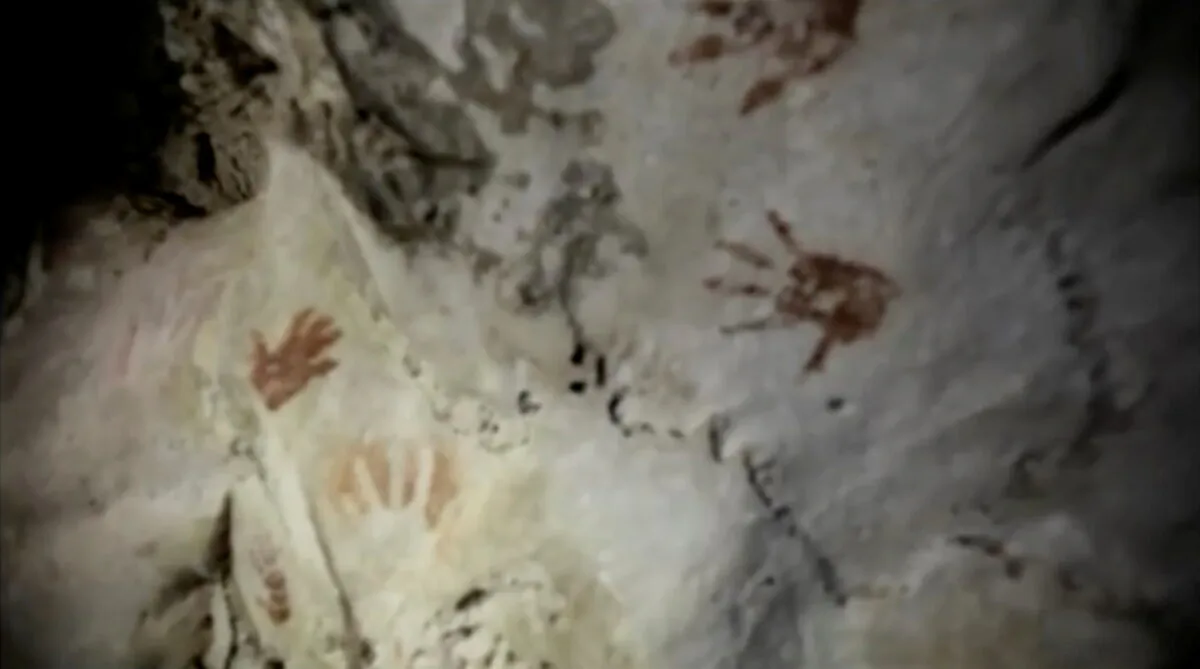 Hand prints, reportedly 1,200 years old, are seen on the cave walls, in Merida, Mexico, on April 2021, in this screengrab taken from a handout video. (Sergio Grosjean/Handout via Reuters)