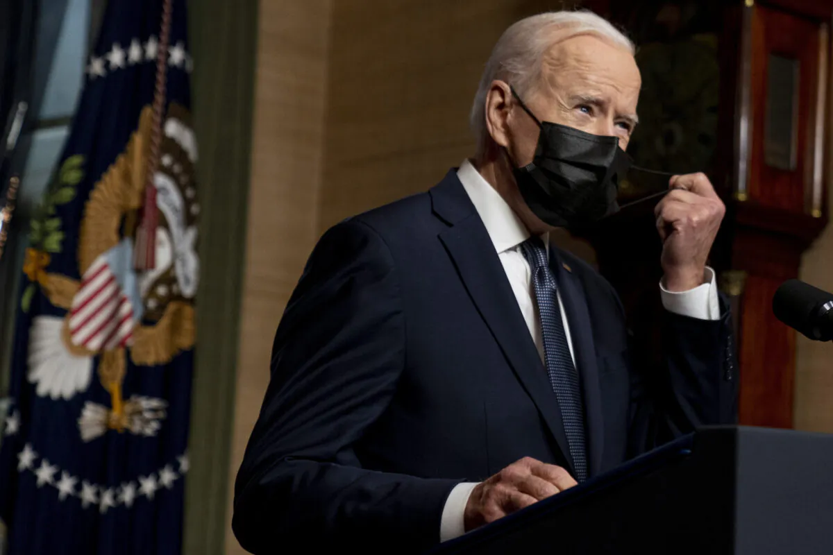 President Joe Biden removes his mask to speak at a news conference at the White House in Washington on April 14, 2021. (Andrew Harnik, Pool, File/AP Photo)