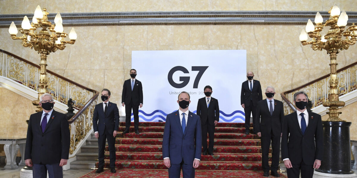 G7 foreign ministers wear face masks and are socially distanced for a group photo
