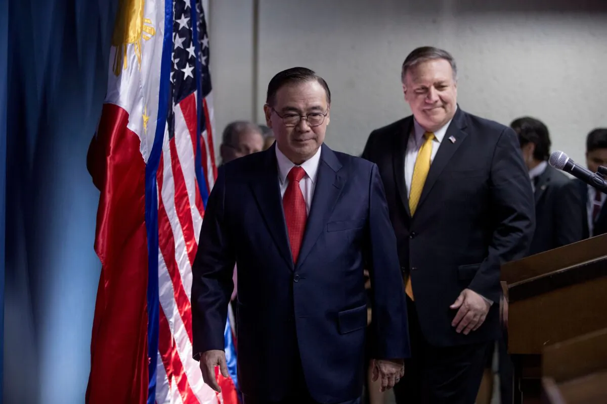 Philippines' Foreign Secretary Teodoro Locsin Jr. (L) and U.S. Secretary of State Mike Pompeo (R) arrive for a news conference at the Philippines Department of Foreign Affairs Home Office in Manila on March 1, 2019. (Andrew Harnik/AFP via Getty Images)
