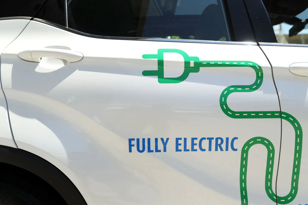 A general view of the stickers on an EV Automotive E3 Glory crossover SUV is seen ahead of the Electric Vehicle Show 2019 at Sydney Olympic Park in Sydney, Australia, on Oct. 25, 2019. (Mark Kolbe/Getty Images)
