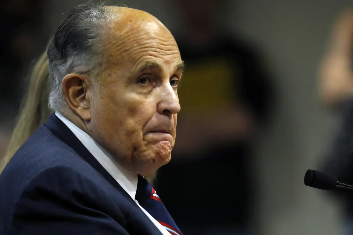 Rudy Giuliani, personal lawyer of President Donald Trump, looks on during an appearance before the Michigan House Oversight Committee in Lansing, Michigan, on Dec. 2, 2020. (Jeff Kowalsky/AFP via Getty Images)