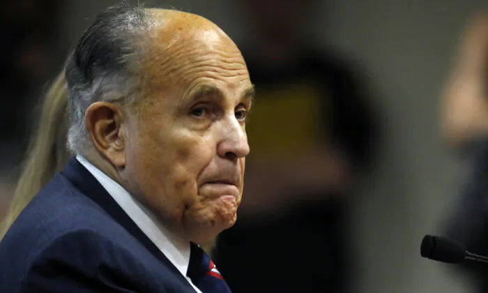 Rudy Giuliani, personal lawyer of President Donald Trump, looks on during an appearance before the Michigan House Oversight Committee in Lansing, Michigan on Dec. 2, 2020. (Jeff Kowalsky/AFP via Getty Images)