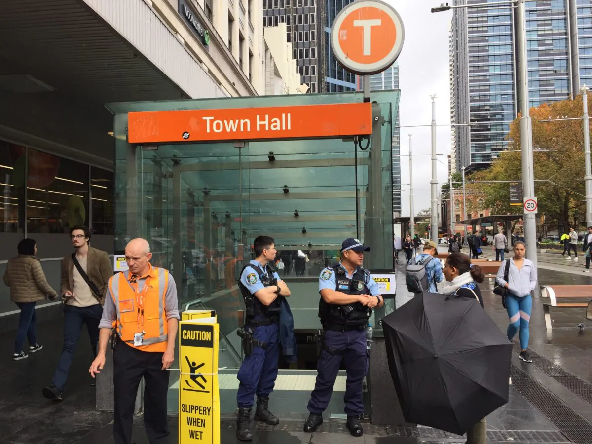 Police block off an entrance to Town Hall train station in Sydney, Wednesday, May 5, 2021. (AAP Image/Lloyd Jones) 