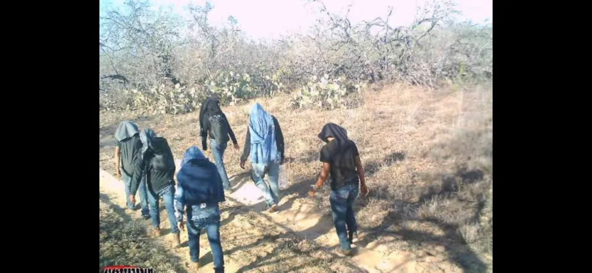 A photo from a game camera that caught illegal aliens walking through private ranch land in Jim Hogg County, Texas, on March 25, 2021. (Courtesy of Susan Kibbe)