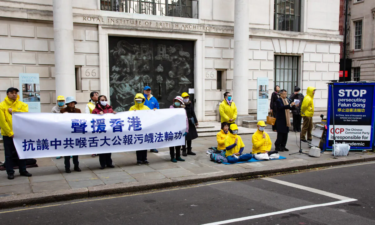 Dr. Wei Liu, chairman of the British Falun Dafa Association, speaks during a protest opposite the Chinese embassy in London after Ta Kun Pao, a HK media outlet widely regarded as a mouthpiece of the CCP, published a series of slanderous articles on Falun Gong, in London on May 4, 2021. (Roger Luo/NTD)