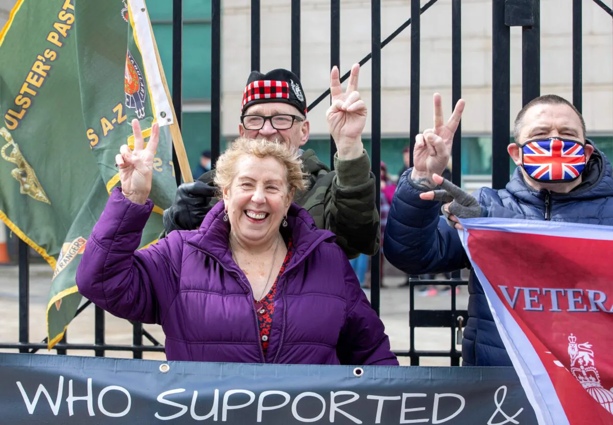 Supporters of Soldier A and Soldier C react after the case against the two former paratroopers collapsed at the High Court in Belfast on May 4, 2021. (Paul Faith/AFP via Getty Images)