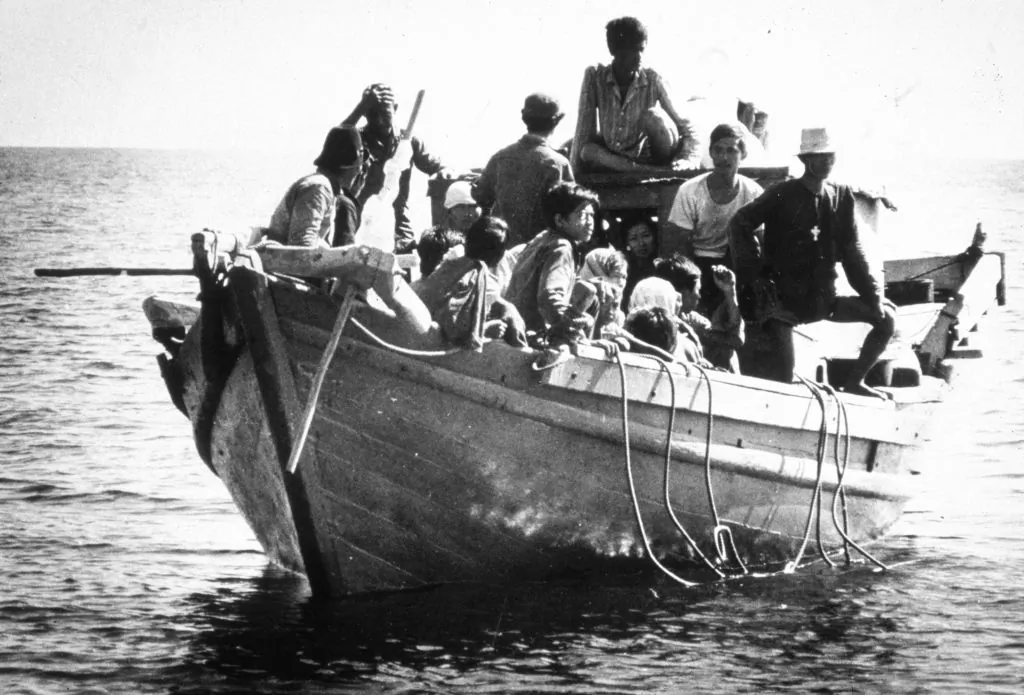 Circa 1975: Refugees from southeast Asia, known as boat people, arriving in the USA. (MPI/Getty Images)