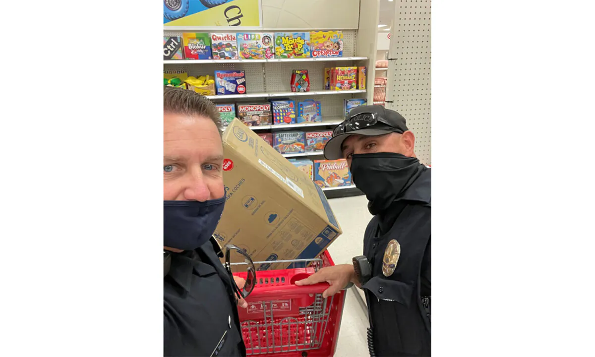 Irvine Police Department officers Brian Smith and Shane Holloway purchased a new car seat for a single mom who couldn't afford one. (Courtesy of the Irvine Police Department)