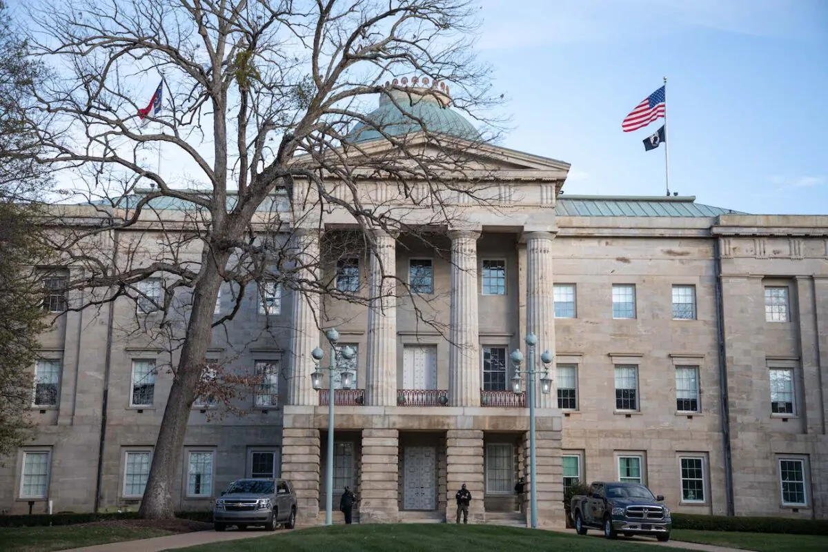 Law enforcement stand guard outside of the state capitol building in downtown Raleigh, N.C., on Jan. 17, 2021. (Logan Cyrus/AFP via Getty Images)