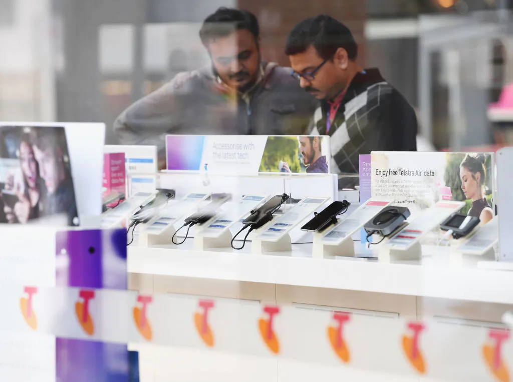 Telstra phones are seen outside the Telstra Melbourne headquarters on June 14, 2017 in Melbourne, Australia. (Photo by Michael Dodge/Getty Images)