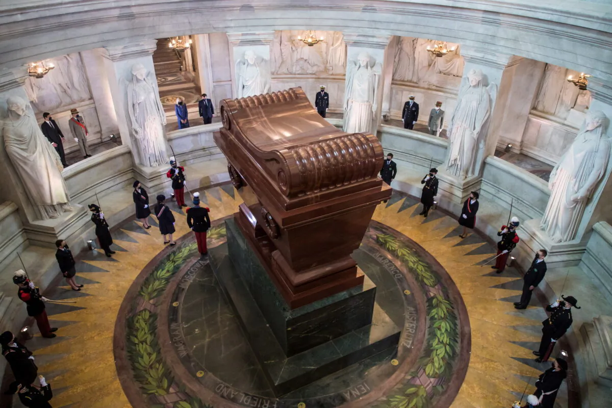 French President Emmanuel Macron and his wife Brigitte Macron stand in front of Napoleon's tomb during a ceremony to commemorate the 200th anniversary of Napoleon Bonaparte's death, at the Hotel des Invalides in Paris, France, May 5, 2021. (Christophe Petit Tesson/Reuters)