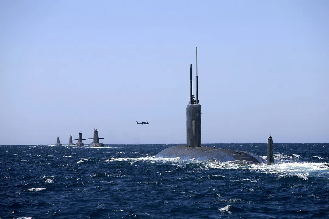 A picture of Australia's current Collins Class Submarines joined in formation by United States Navy Submarine USS Santa Fe in the West Australian Exercise Area in February 2019. (Courtesy of LSIS Richard Cordell/Department of Defense)
