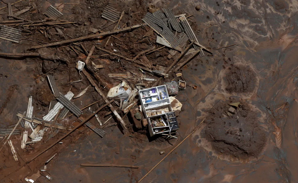 Debris in Bento Rodrigues district, which was covered with mud after a dam owned by Vale SA and BHP Billiton Ltd burst, in Mariana, Brazil, on Nov. 10, 2015. (Ricardo Moraes/Reuters)